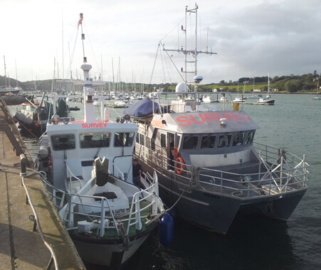 RV Cosantóir Bradán and RV Keary alongside in Crosshaven. Note the tow-mount for the multibeam sonar on on the Cosantóir Bradán which is in the raised position