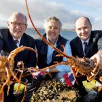 John Hackett, BIM; Loic Trahan, Breizon Ltd and Jason Whooley, BIM with locally caught crayfish in Rossaveal, Co Galway