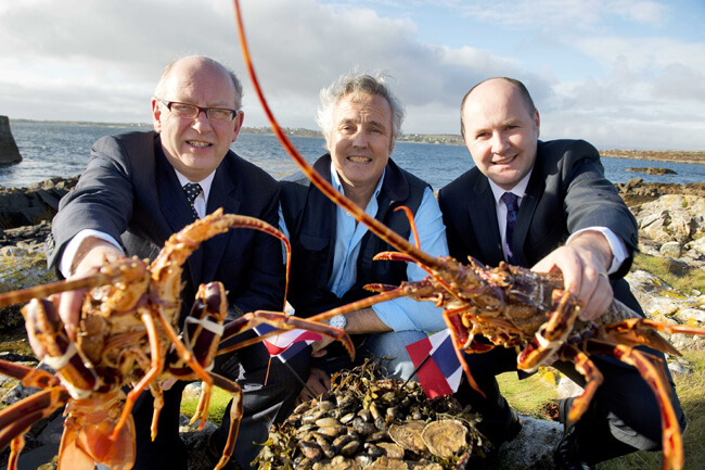 John Hackett, BIM; Loic Trahan, Breizon Ltd and Jason Whooley, BIM with locally caught crayfish in Rossaveal, Co Galway
