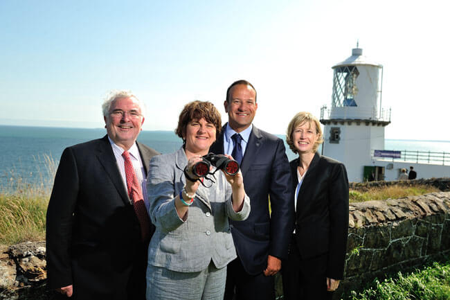Pat Colgan, SEUPB; Minister Arlene Foster; Minister Simon Coveney and Yvonne Shields, CIL at Blackhead Lighthouse, Co Antrim