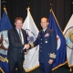 Michael Kingston receives the Challenge Coin Award from Capt John Mauger, Commanding Officer USCG Maritime Safety Centre HQ